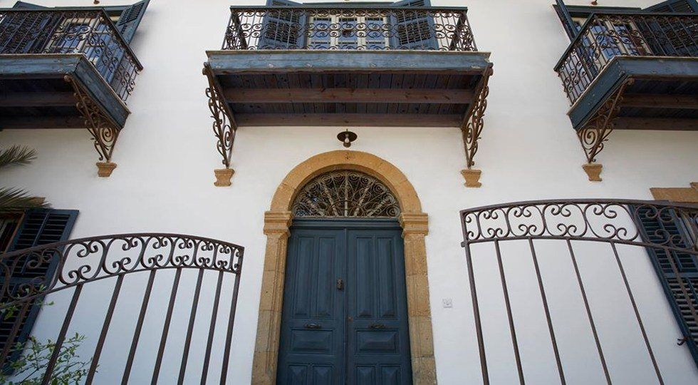 Iron stair railings leading to front door