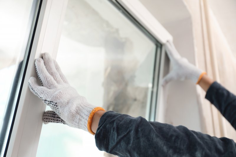 person installing new windows 