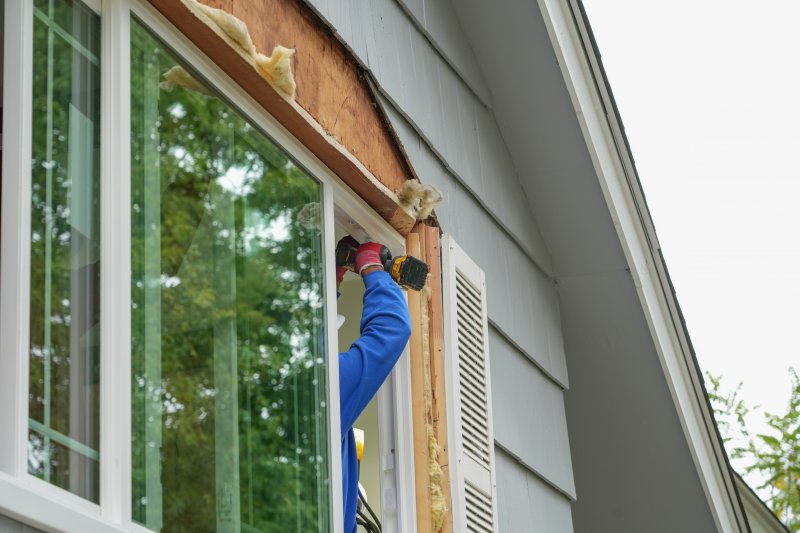 installation professional putting in new windows 